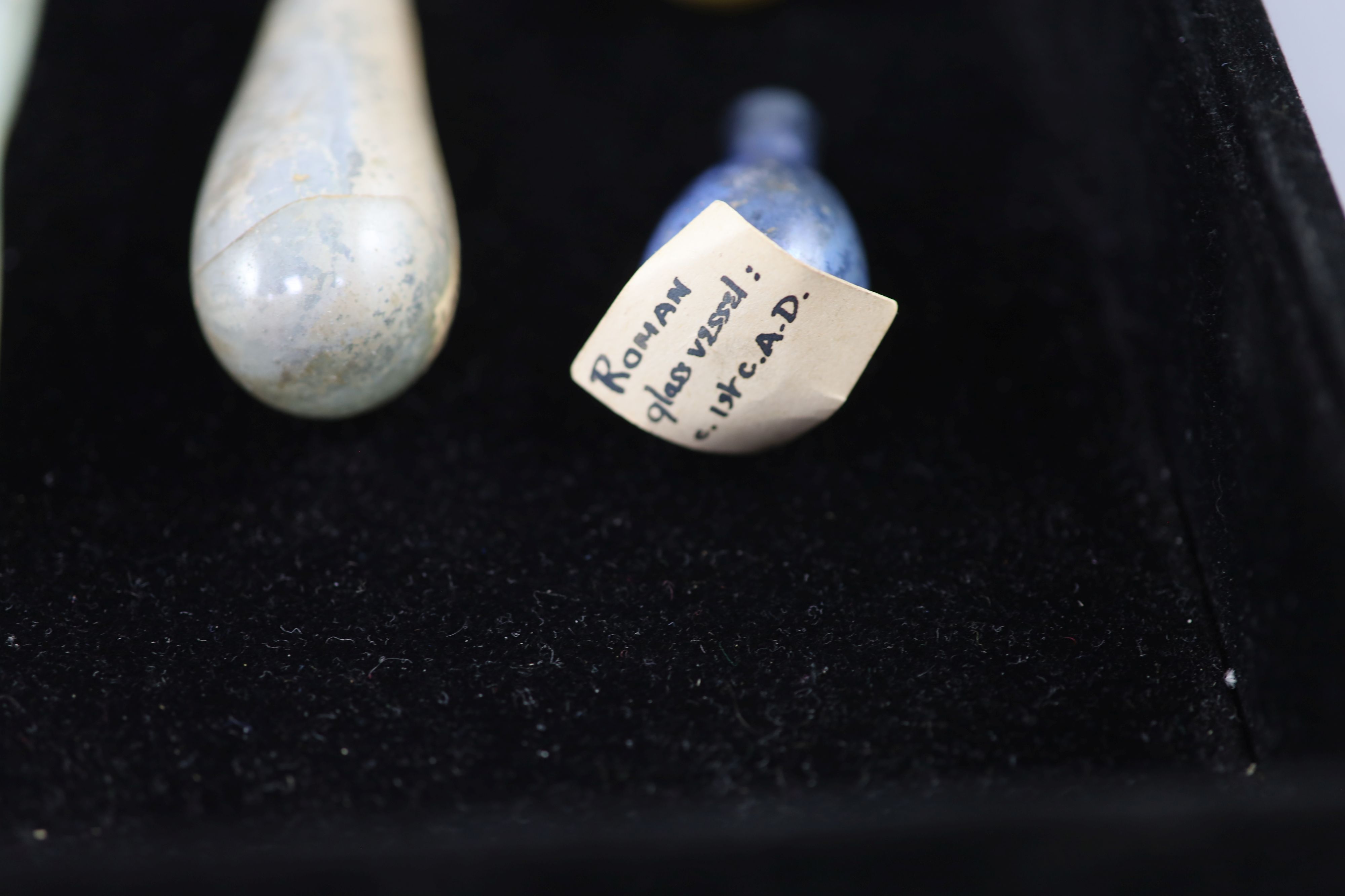 A group of three Roman glass vessels and Egyptian/Roman glass fragments, Provenance - A. T. Arber-Cooke